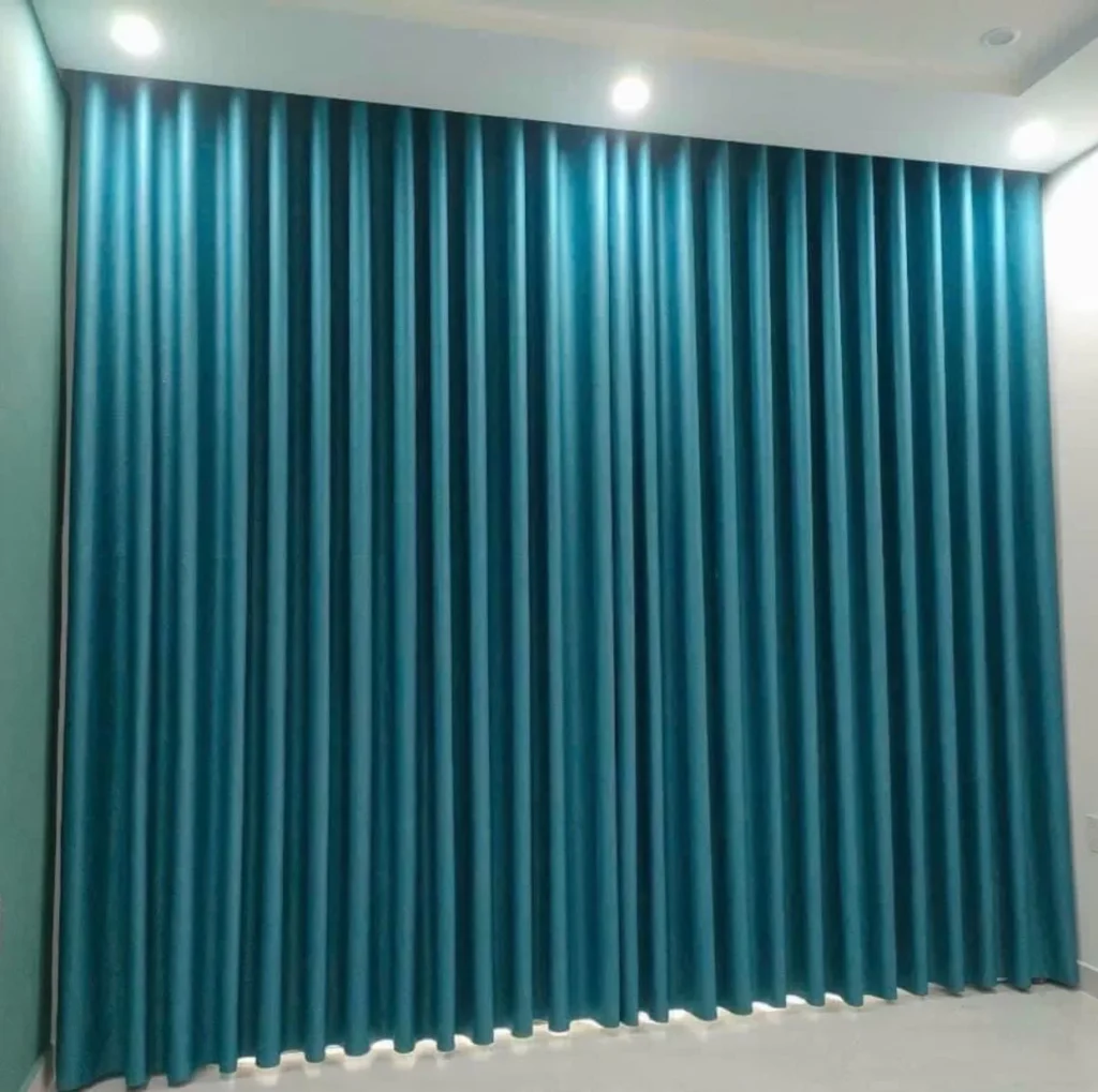 Mẫu rèm vải màu xanh ngọc đẹp chống nắng